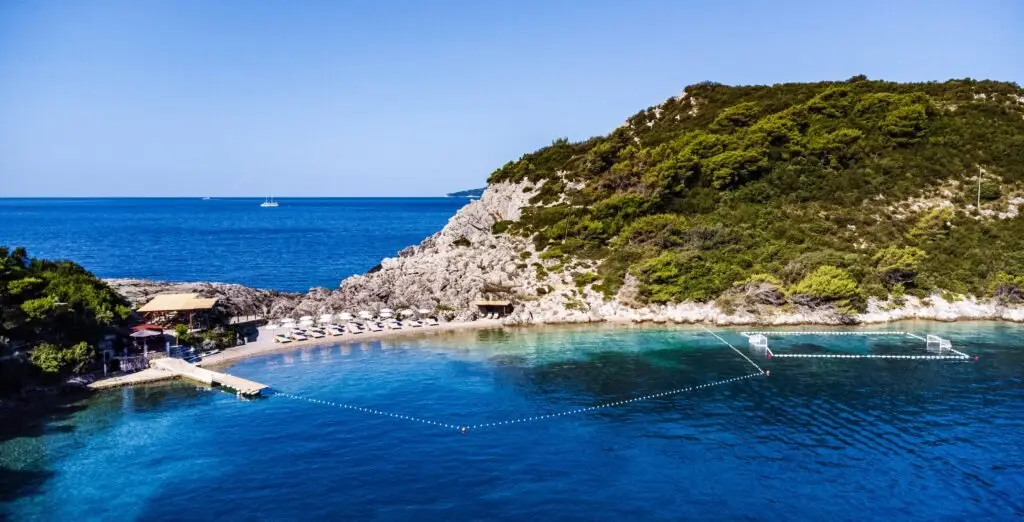 Priježba beach on Šipan with the sea court and a pirate boat